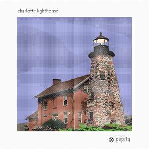 Tall and stately lighthouse on a grassy bluff against the dusky sky.