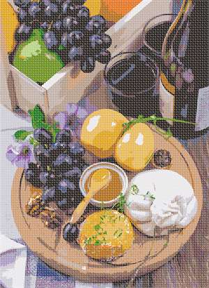 Grapes, wine, honey and walnuts served up on a platter along with some petunias for decor