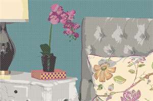 Orchids rest on the bedside table near this chic bed. The pillow and headboard are inviting