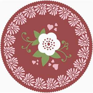 A doily with a floral center in red.