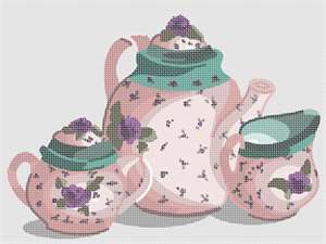 A matching set of florally decorated china: one for tea, one cream, and one sugar, in shades of pink and green.