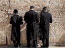 Praying fervently at the Western Wall Kotel