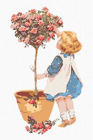 Tiffany stands on tiptoe to reach the topiary top she is pruning to perfection.