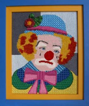 Sad but happy. &quot;Down Clown&quot; in his colorful new frame.